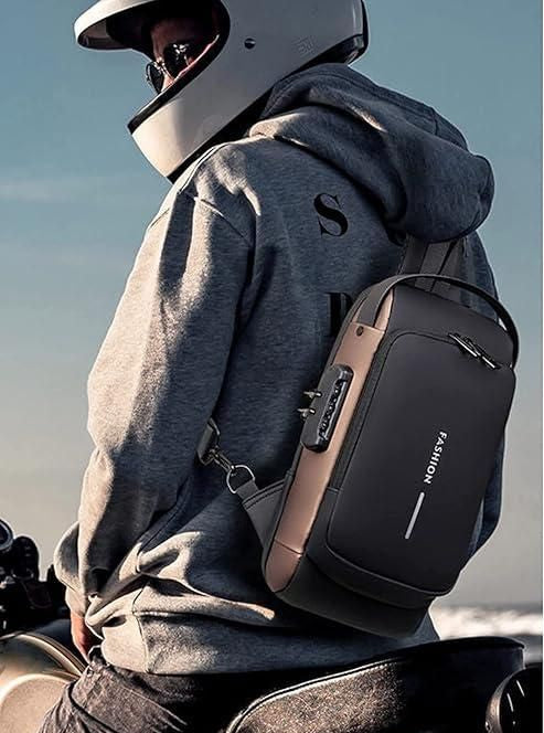 Person wearing a black crossbody bag with USB charging port, sitting on a motorcycle.
